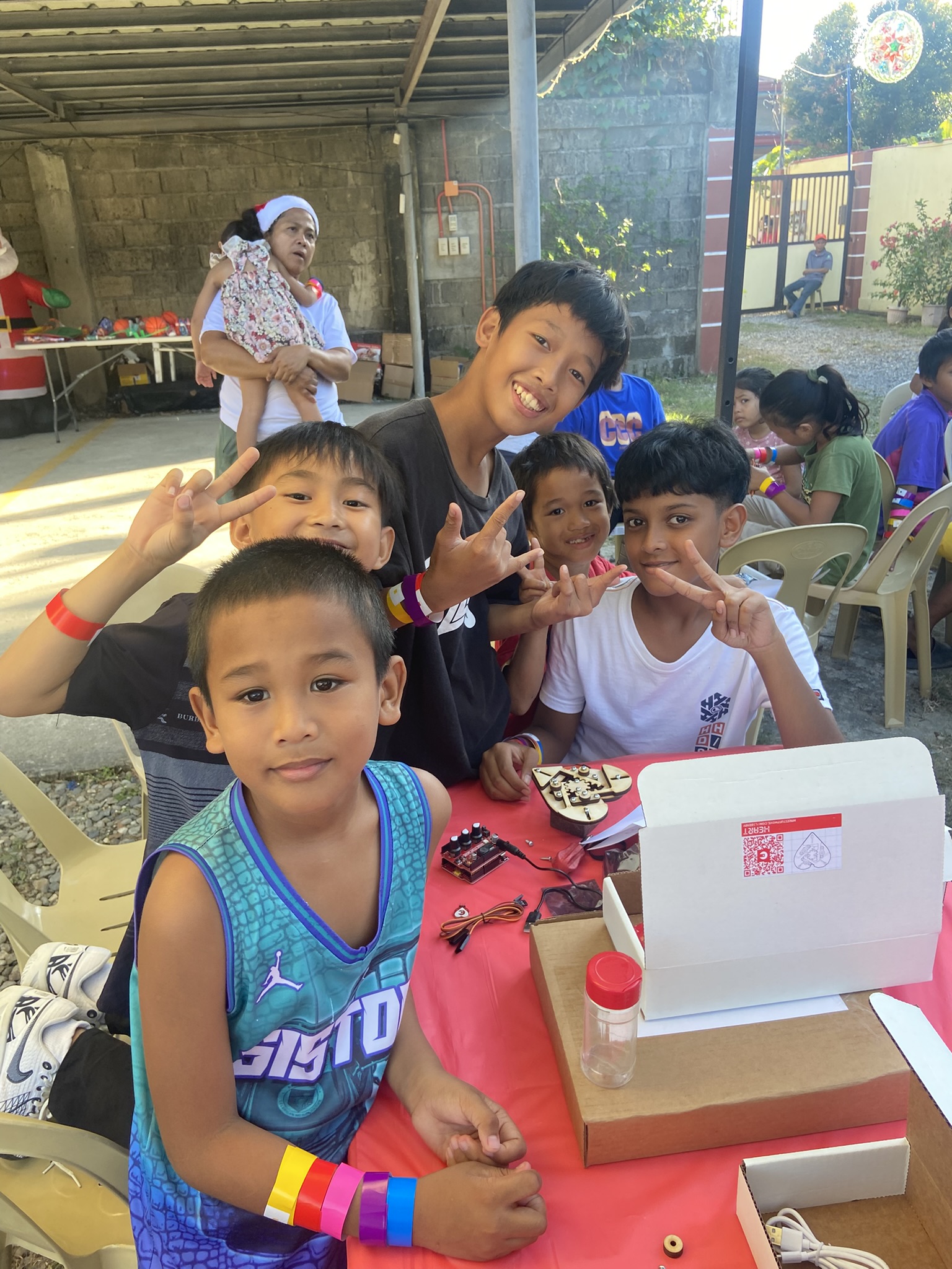 Volunteers with children at the 2025 Feeding Project